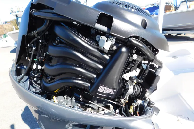 Slide: The Image of 2019 Key West 1720 Center Console boat engine close-up, showcasing intricate mechanical details. - 21