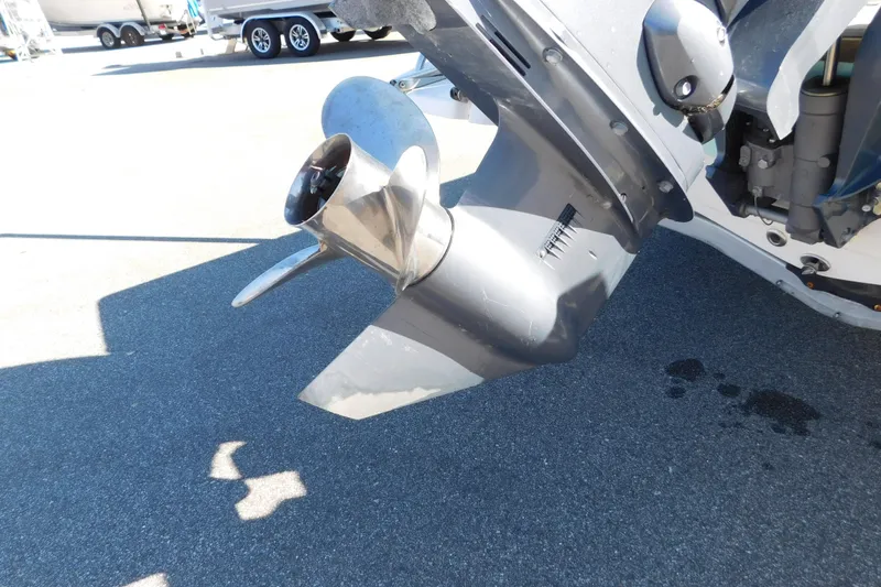 Slide: The Image of Outboard motor propeller of 2019 Key West 1720 Center Console boat on pavement. - 4