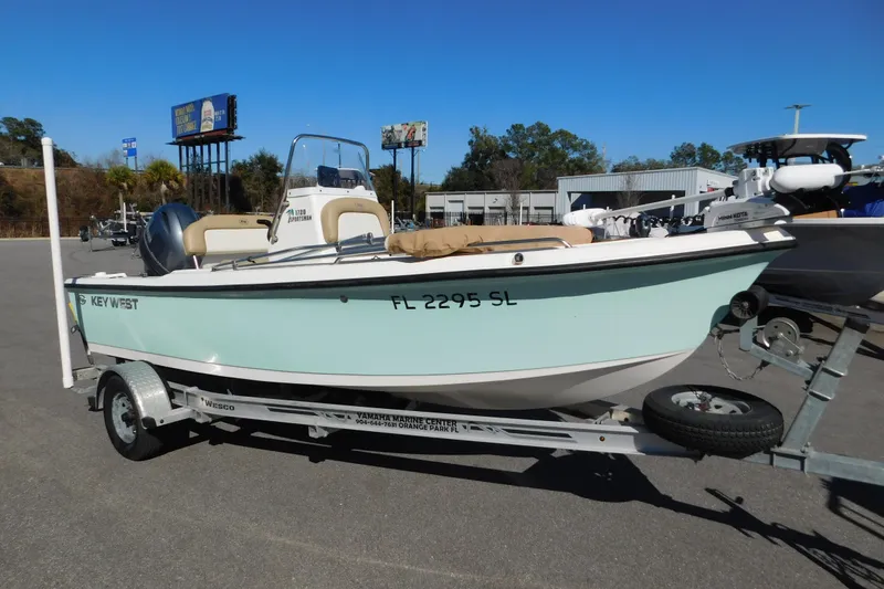 Slide: The Image of 2019 Key West 1720 Center Console boat on trailer, parked outdoors. - 6