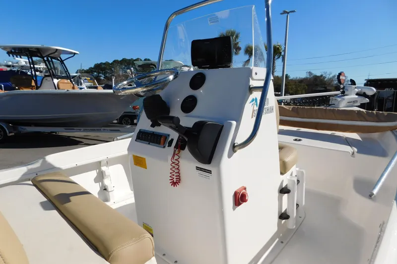 Slide: The Image of 2019 Key West 1720 Center Console boat with steering wheel and control panel. - 8