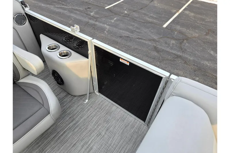 Slide: The Image of 2021 Bennington L 22 Quad Bench interior with cup holders and speaker. - 14