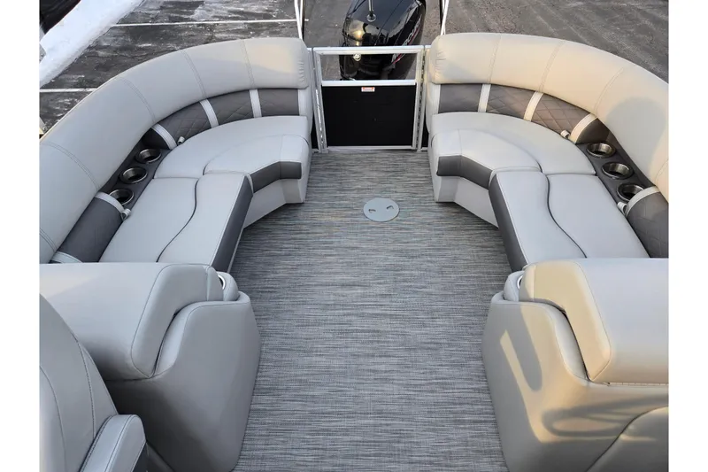 Slide: The Image of 2021 Bennington L 22 Quad Bench interior with luxurious seating and cup holders. - 15