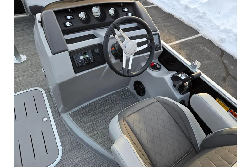 Slide: The Image of 2021 Bennington L 22 Quad Bench boat interior with steering wheel and control panel. - 19