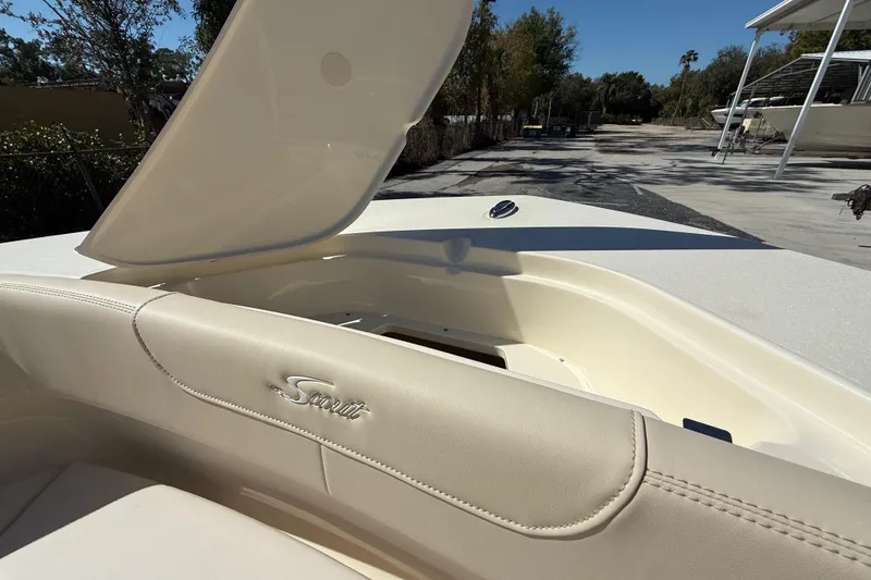 Slide: The Image of 2026 Scout 220 XSF boat interior with open storage compartment, showcasing luxury design. - 19