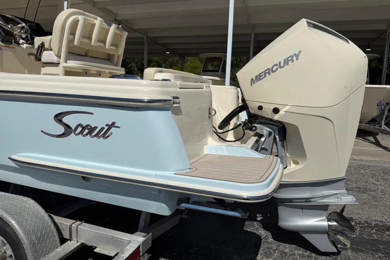 Slide: The Image of 2026 Scout 220 XSF boat with Mercury outboard engine on trailer. - 2
