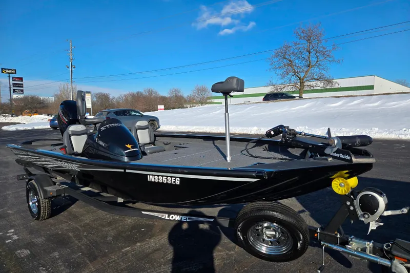 Slide: The Image of 2021 Lowe Stinger 175C fishing boat on trailer, parked on snowy pavement. - 5