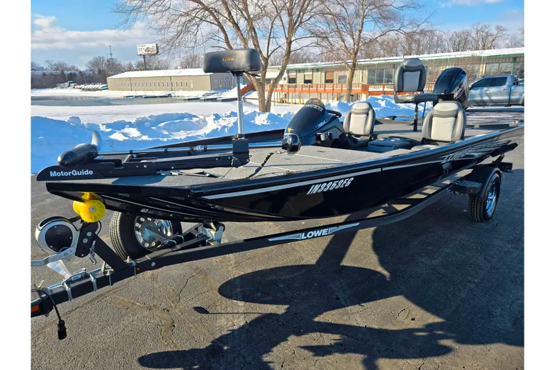 Slide: The Image of 2021 Lowe Stinger 175C fishing boat on trailer in snowy parking lot. - 9