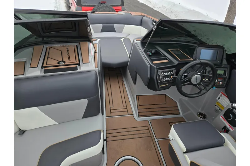 Slide: The Image of 2021 Moomba Max boat interior with modern dashboard and seating. - 12