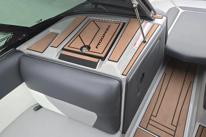 Slide: The Image of 2021 Moomba Max boat interior with sleek wood and leather design. - 15