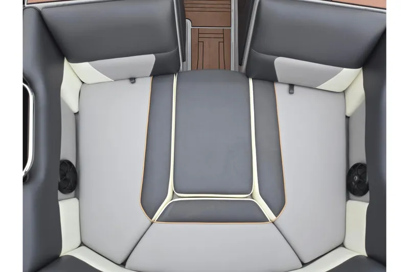 Slide: The Image of 2021 Moomba Max boat interior with gray and black cushioned seating. - 21