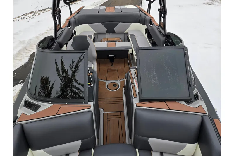 Slide: The Image of 2021 Moomba Max boat interior with modern seating and dashboard design. - 22