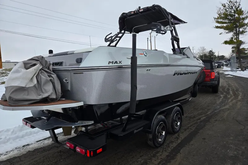 Slide: The Image of 2021 Moomba Max boat on trailer in snowy outdoor setting. - 3