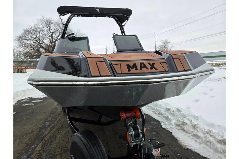 Slide: The Image of 2021 Moomba Max boat on trailer, snowy background, front view. - 6