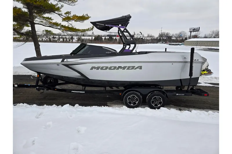 Slide: The Image of 2021 Moomba Max boat on trailer in snowy landscape. - 9