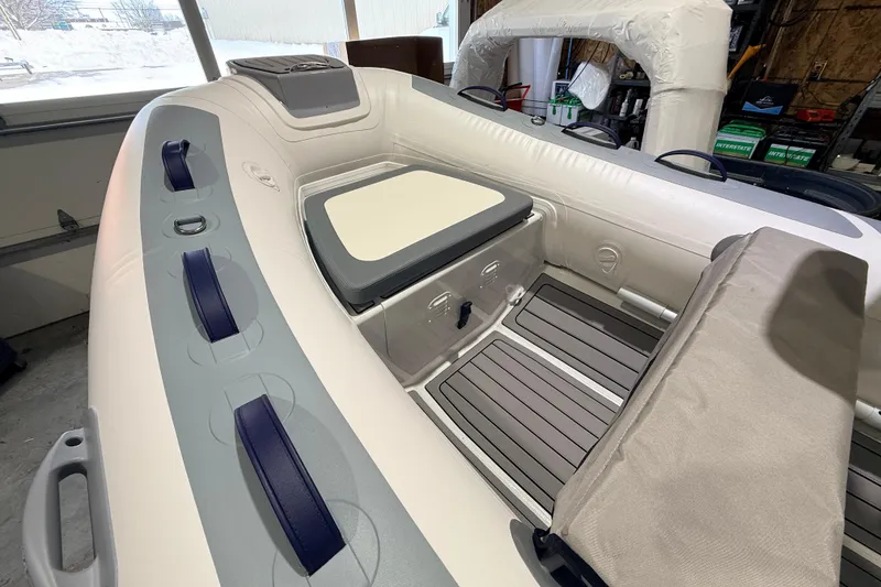 Slide: The Image of 2026 Highfield Classic 340 FCT inflatable boat interior with seating and storage. - 7