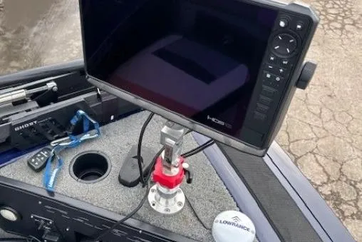 Slide: The Image of 2019 Tracker Targa V-18 Combo boat dashboard with Lowrance fishfinder and controls. - 10