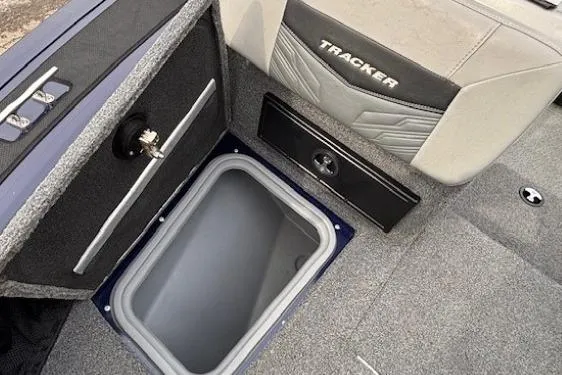 Slide: The Image of 2019 Tracker Targa V-18 Combo boat interior with storage compartment and seating. - 12
