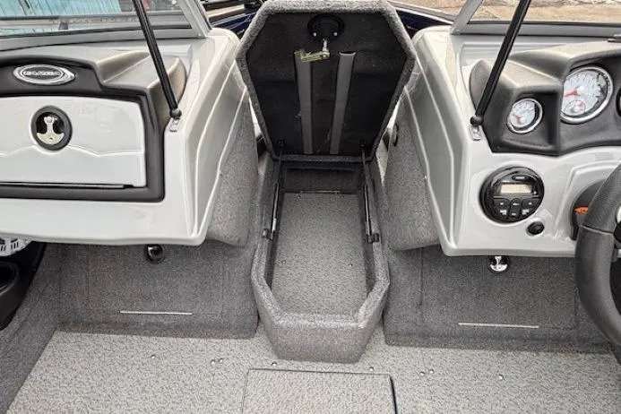 Slide: The Image of 2019 Tracker Targa V-18 Combo boat interior with dashboard and storage compartment. - 14