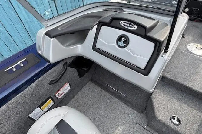 Slide: The Image of 2019 Tracker Targa V-18 Combo boat interior with steering console and seating. - 21