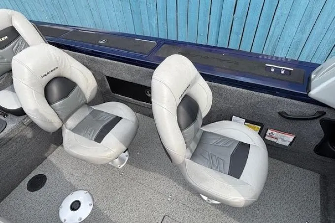 Slide: The Image of 2019 Tracker Targa V-18 Combo boat interior with two gray seats. - 23