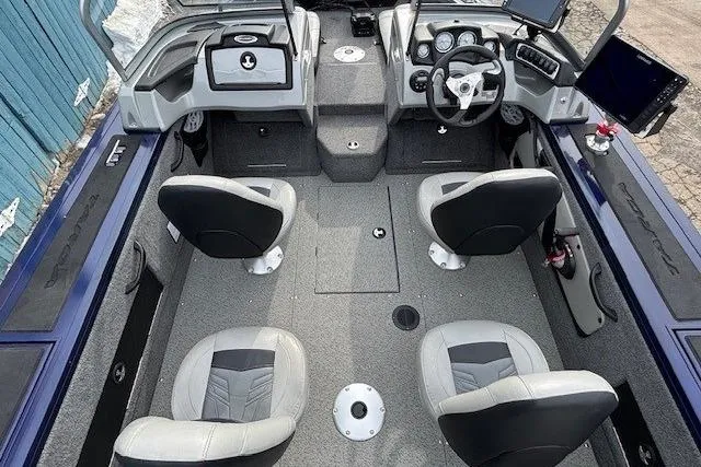 Slide: The Image of 2019 Tracker Targa V-18 Combo boat interior with four seats and modern dashboard. - 24