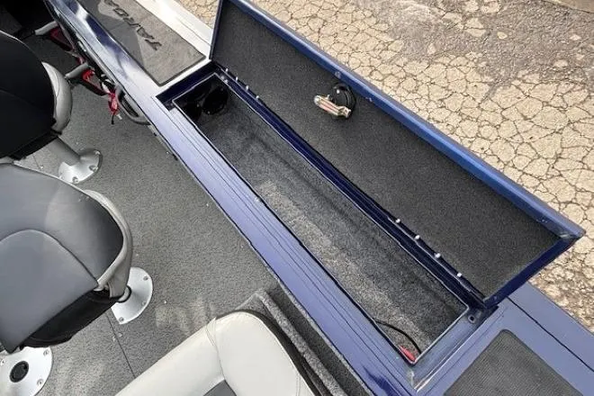Slide: The Image of 2019 Tracker Targa V-18 Combo boat interior with open storage compartment and seating. - 28