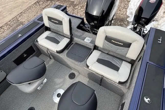 Slide: The Image of 2019 Tracker Targa V-18 Combo boat interior with seating and dual outboard motors. - 30