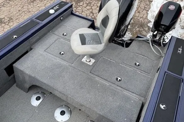 Slide: The Image of 2019 Tracker Targa V-18 Combo boat interior with seating and storage compartments. - 34