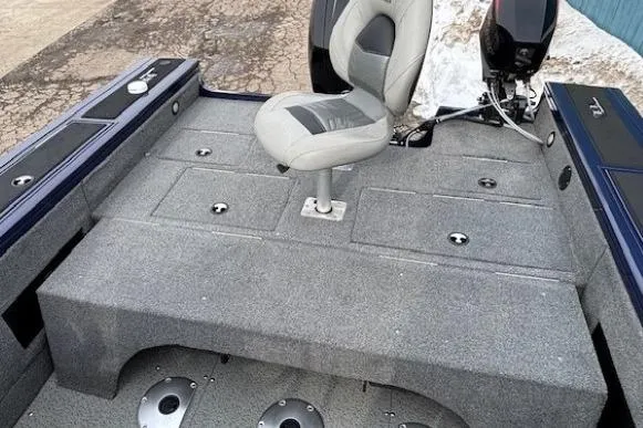 Slide: The Image of 2019 Tracker Targa V-18 Combo boat interior with seating and storage compartments. - 35
