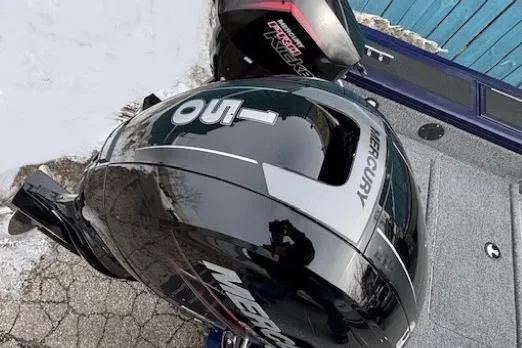 Slide: The Image of 2019 Tracker Targa V-18 Combo with Mercury outboard motor, parked on pavement. - 39