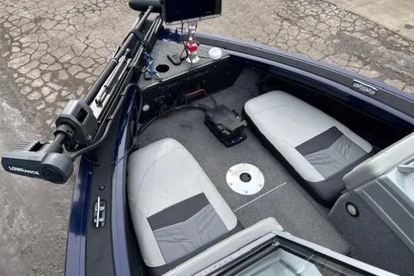 Slide: The Image of 2019 Tracker Targa V-18 Combo boat interior with seating and fishing equipment. - 8