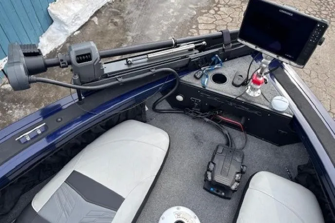 Slide: The Image of 2019 Tracker Targa V-18 Combo boat interior with seats, control panel, and navigation equipment. - 9