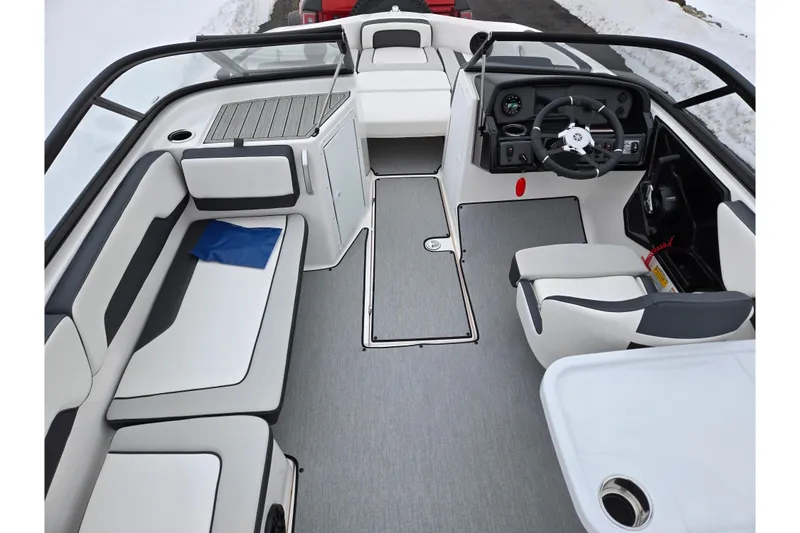 Slide: The Image of 2023 Yamaha Boats AR195 interior with modern seating and steering console. - 11
