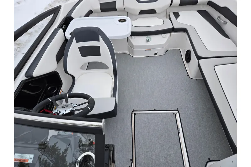 Slide: The Image of 2023 Yamaha Boats AR195 interior with sleek seating and modern steering wheel design. - 20