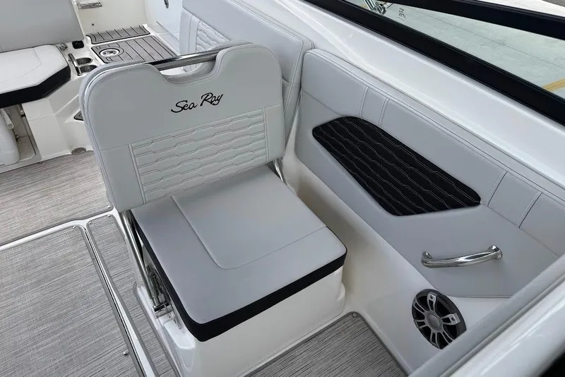 Slide: The Image of 2023 Sea Ray SPX 230 boat interior with sleek seating and modern design. - 19