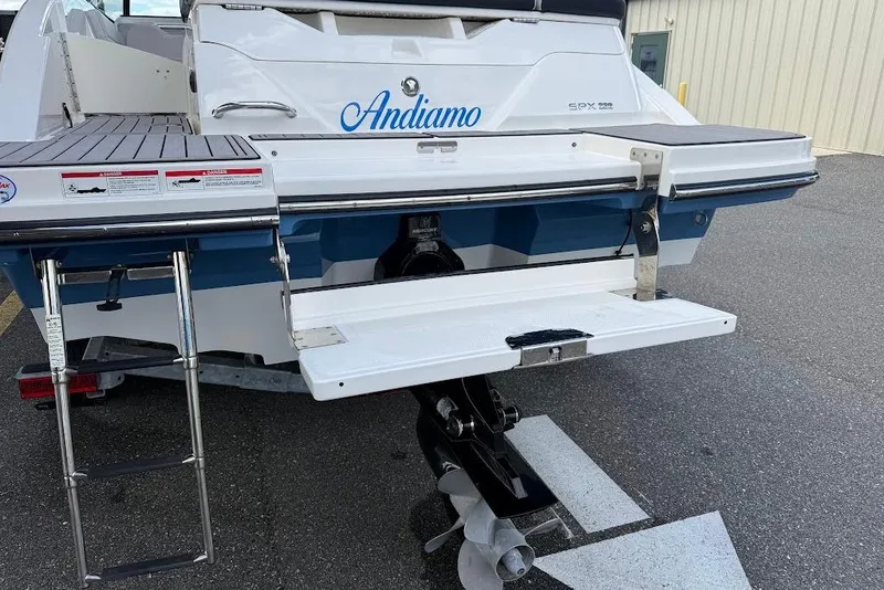 Slide: The Image of 2023 Sea Ray SPX 230 boat stern with swim platform and ladder. - 8