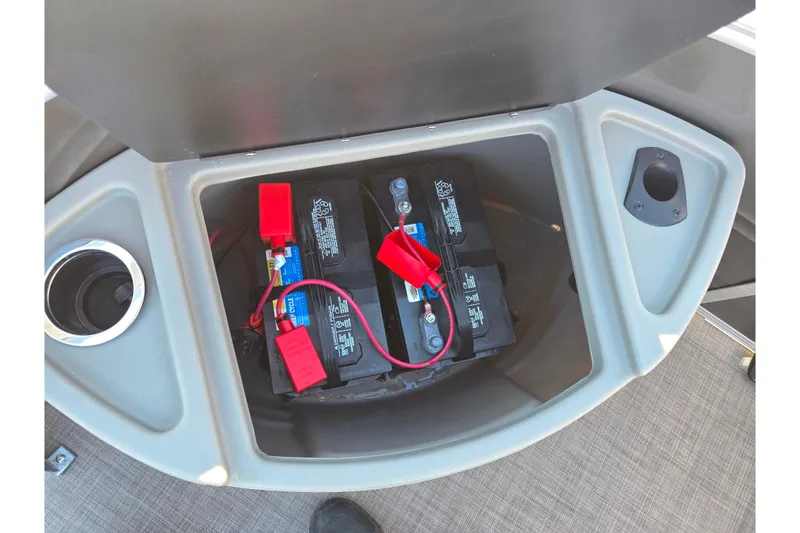 Slide: The Image of 2024 Sun Tracker Fishin' Barge 20 DLX battery compartment with dual batteries and wiring. - 25