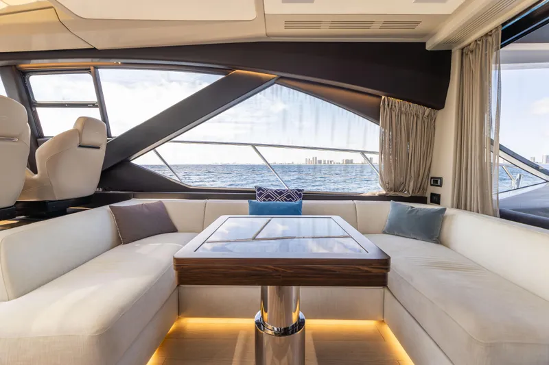Slide: The Image of Luxurious interior of 2021 Azimut S6 yacht with plush seating and scenic views. - 22