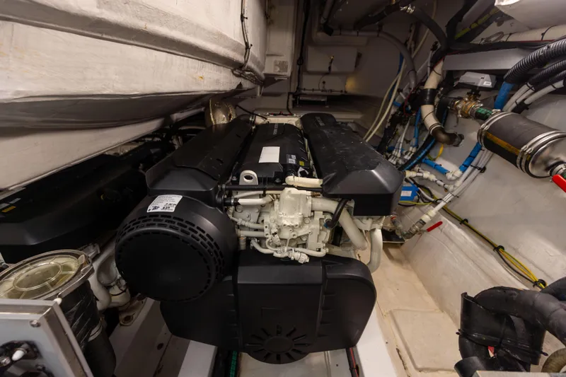 Slide: The Image of 2021 Azimut S6 yacht cruising on a sunny day with city skyline in the background. - 34