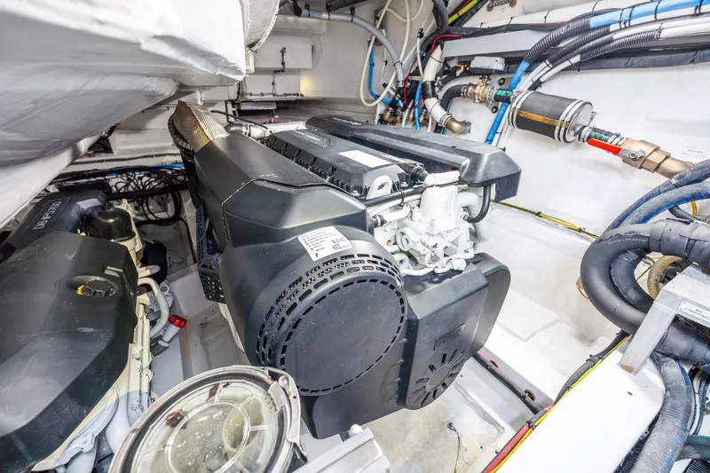 Slide: The Image of Engine room of 2021 Azimut S6 yacht, showcasing advanced machinery and wiring. - 49