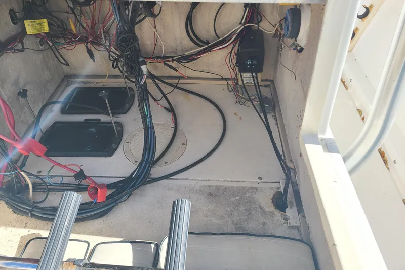 Slide: The Image of 1995 Mako 201 Center Console boat interior wiring and compartments. - 20