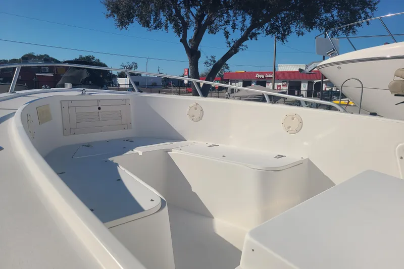 Slide: The Image of 1995 Mako 201 Center Console boat interior with seating and storage compartments. - 4