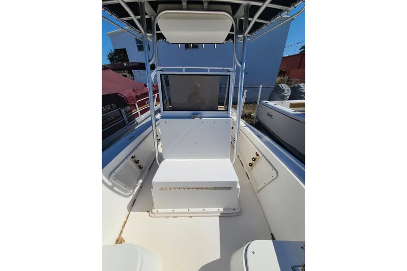 Slide: The Image of 1995 Mako 201 Center Console boat interior with seating and console view. - 5