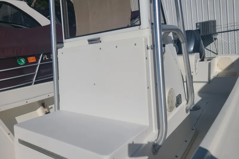 Slide: The Image of 1995 Mako 201 Center Console boat interior with steering console and seating. - 6