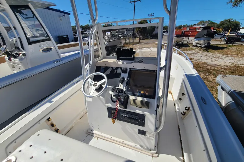 Slide: The Image of 1995 Mako 201 Center Console boat interior with steering wheel and control panel. - 9