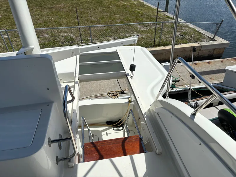 Slide: The Image of 2004 Sabreline 36 Sedan boat deck and stairs to lower level. - 18