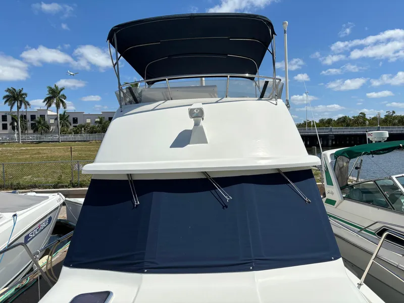 Slide: The Image of 2004 Sabreline 36 Sedan yacht docked, blue sky. - 3