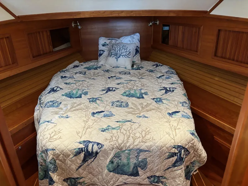 Slide: The Image of Interior of 2004 Sabreline 36 Sedan with nautical-themed bedding. - 47