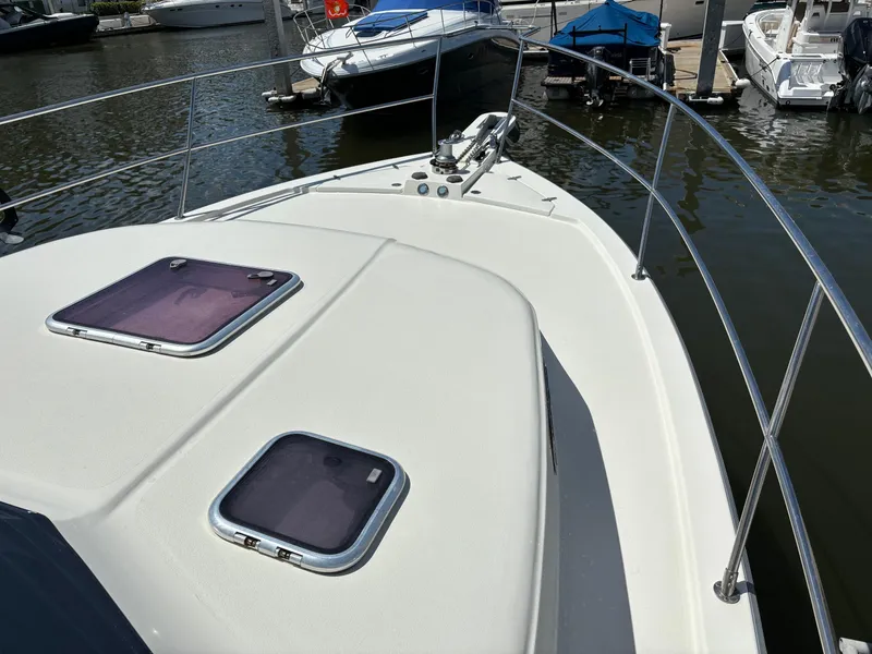 Slide: The Image of 2004 Sabreline 36 Sedan docked in a calm marina. - 5
