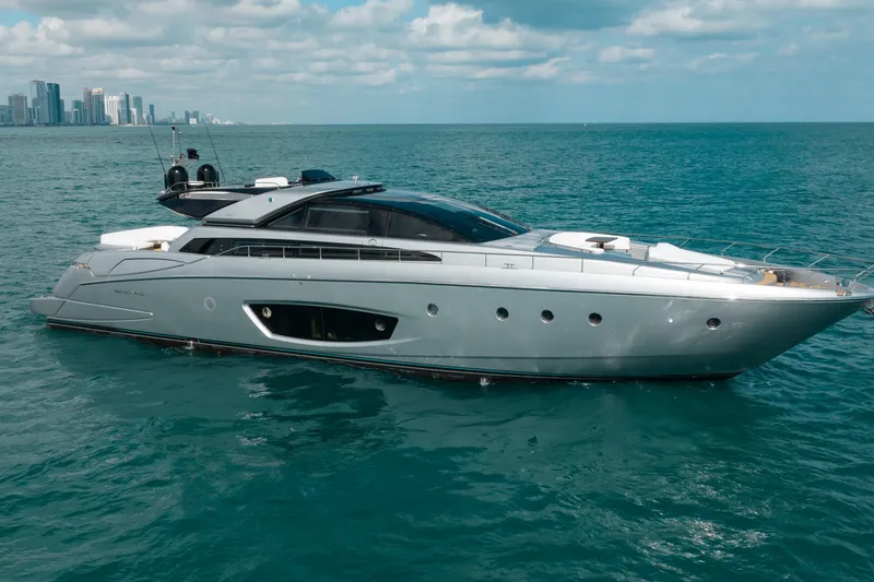 Slide: The Image of Luxury 2014 Riva 86' DOMINO yacht cruising near city skyline. - 0